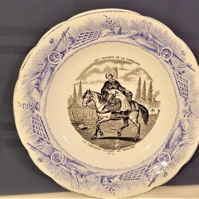 Lot #242  Charming Antique French Plate "The Lady Farmer"