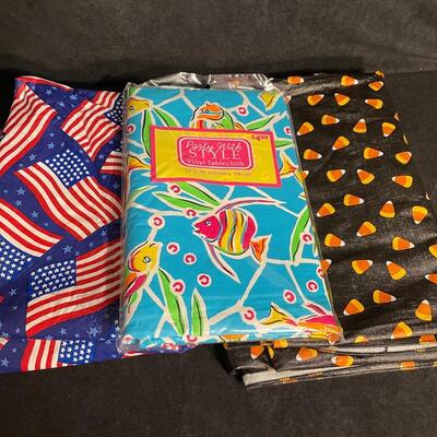 Lot 98  Three plastic tablecloths