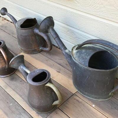 Four Copper Watering cans. Local pick up only in Auburn, CA.