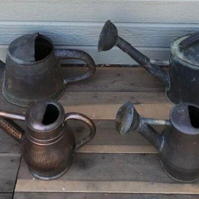 Four Copper Watering cans. Local pick up only in Auburn, CA.