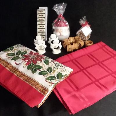 Lot 193 Red and Christmas Tablecloths, 2 Christmas Candles, Napkin Ring Sets