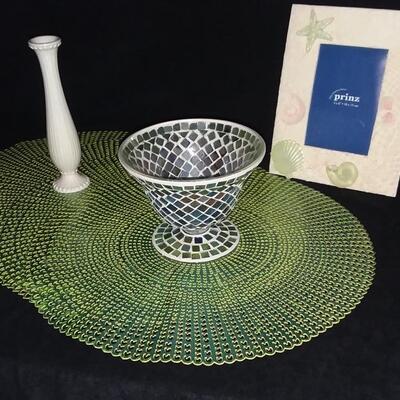 Lot 202  Mosaic Candle Dish, Ivory Bud Vase, Metallic Round Placemats, and Seashell Frame