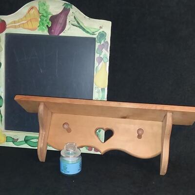 Lot 205  Wooden Shelf with Pegs, Chalkboard, and Jar Candle