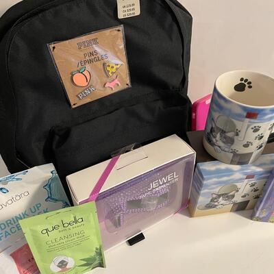 Lot 293  New Pink Backpack, Cat Mug, Face Beauty Masks, Tape Dispenser and Address Book