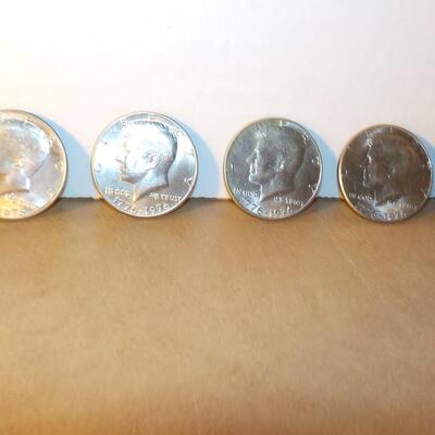 5 Kennedy centennial  half dollars in mint shape.