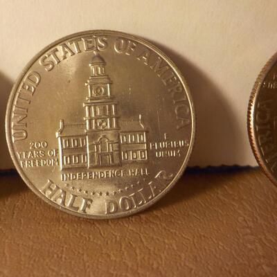 5 Kennedy centennial  half dollars in mint shape.