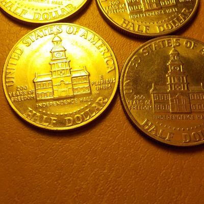 4 Kennedy half dollars 1776-1976.