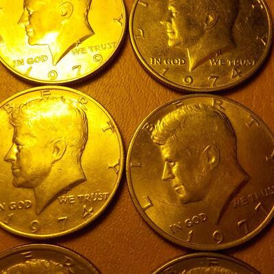 8 Kennedy half dollar coins.