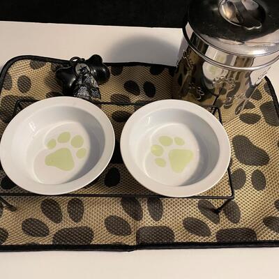 Lot 424  Pet Items: Floor-mat, Treat Container, 2 Bowl Food Stand, and Pooh Bags