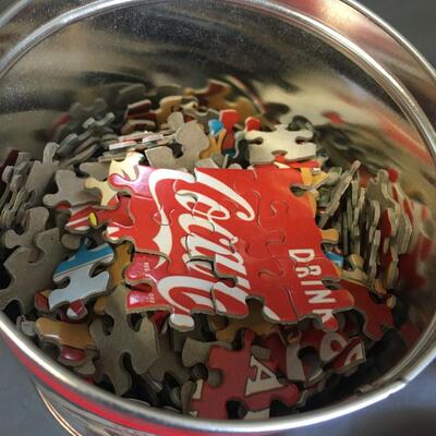 Puzzle coke tin