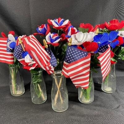 Red, White, and Blue Flowers in Milk Jug Bottle Vases