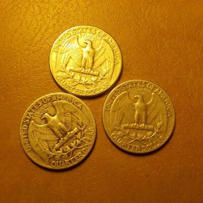 3- 1950's silver quarters.