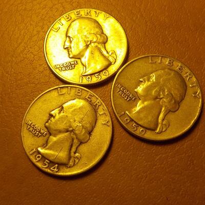 3- 1950's silver quarters.