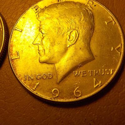 2- 1964 Kennedy Silver half dollars.