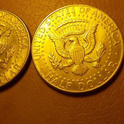 2- 1964 Kennedy Silver half dollars.
