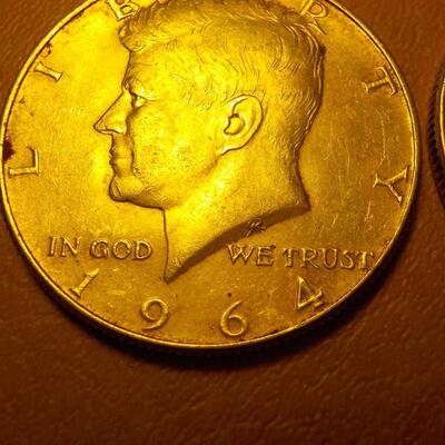 2- 1964 Kennedy Silver half dollars.