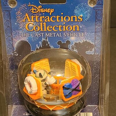 Lot 20: Disney Attractions Die Cast Collectibles: Winnie the Pooh & Kali River Rapids 