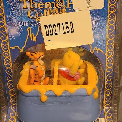 Lot 20: Disney Attractions Die Cast Collectibles: Winnie the Pooh & Kali River Rapids 