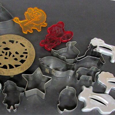 Vintage Aluminum and Plastic Cookie Cutters and Brass Trivet 