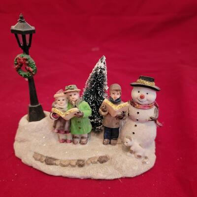 Snowman and Carolers