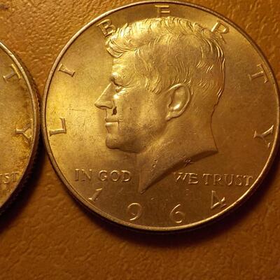 2- 1964 Kennedy Silver half dollars.