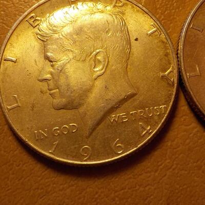 2- 1964 Kennedy Silver half dollars.