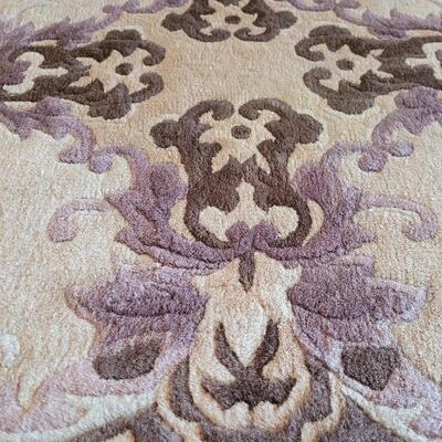 Lot 57: Purple, Cream & Brown Rug