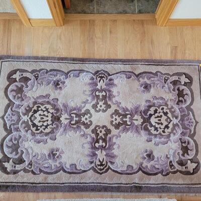 Lot 57: Purple, Cream & Brown Rug