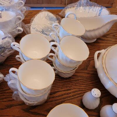 Lot 85: Wedgwood Gold Chelsea (many pieces still New in original packaging)