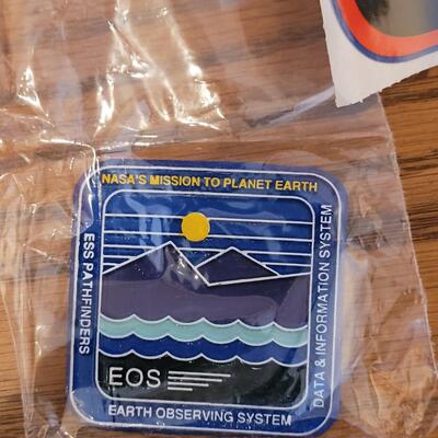 Lot 133: Commemorative NASA Stickers and Magnet