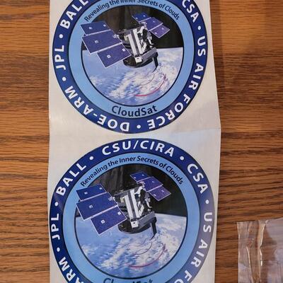 Lot 133: Commemorative NASA Stickers and Magnet
