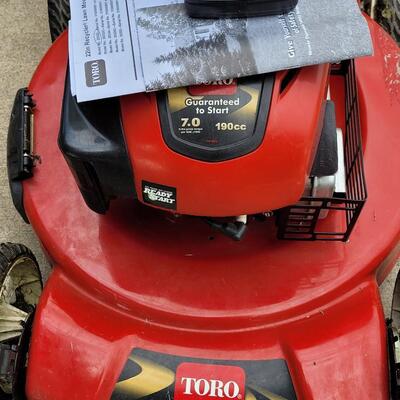 Lot 294: Toro 22" Recycler Lawn Mower with Manual. Small Engine Oil and 1 gallon Gas Can- Does not turn on and has a gas leak