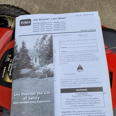 Lot 294: Toro 22" Recycler Lawn Mower with Manual. Small Engine Oil and 1 gallon Gas Can- Does not turn on and has a gas leak