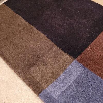 Lot 362: Crate & Barrel Area Rug (has indents from furniture)