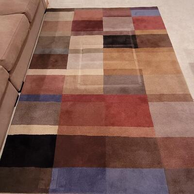 Lot 362: Crate & Barrel Area Rug (has indents from furniture)