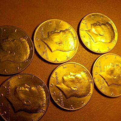 6- Kennedy half dollars 1973,74,79,72.