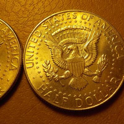 2- 1964 Kennedy Silver half dollars.