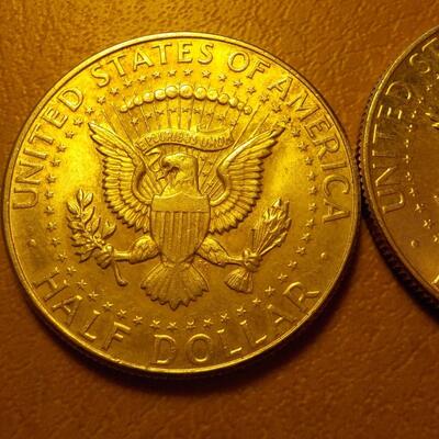 2- 1964 Kennedy Silver half dollars.