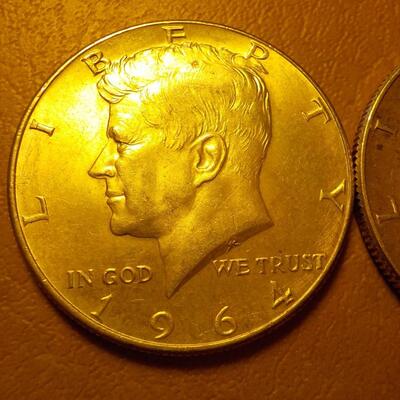 2- 1964 Kennedy Silver half dollars.