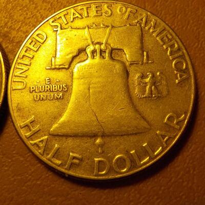 1958 and 1951 Benjamin silver half dollars.