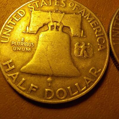 1958 and 1951 Benjamin silver half dollars.