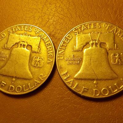 1958 and 1951 Benjamin silver half dollars.