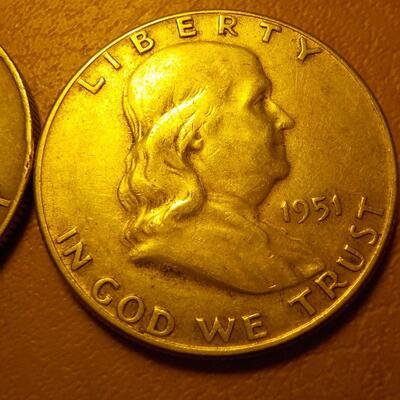 1958 and 1951 Benjamin silver half dollars.