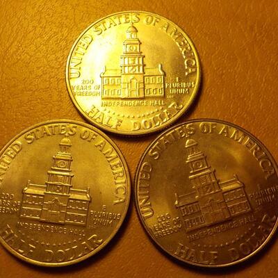 3- Kennedy centennial half dollars.