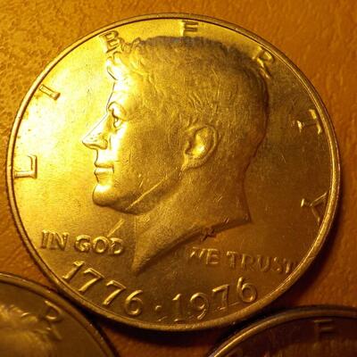 3- Kennedy centennial half dollars.