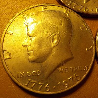 3- Kennedy centennial half dollars.