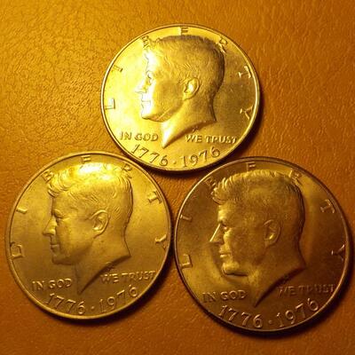 3- Kennedy centennial half dollars.