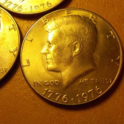 3- Kennedy centennial half dollars.