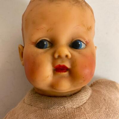 Vintage baby doll with rubber body parts and cloth torso