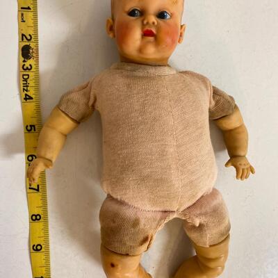 Vintage baby doll with rubber body parts and cloth torso